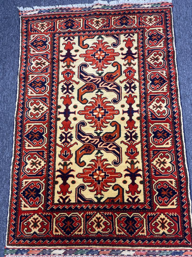Hand-knotted area carpet in geometric design